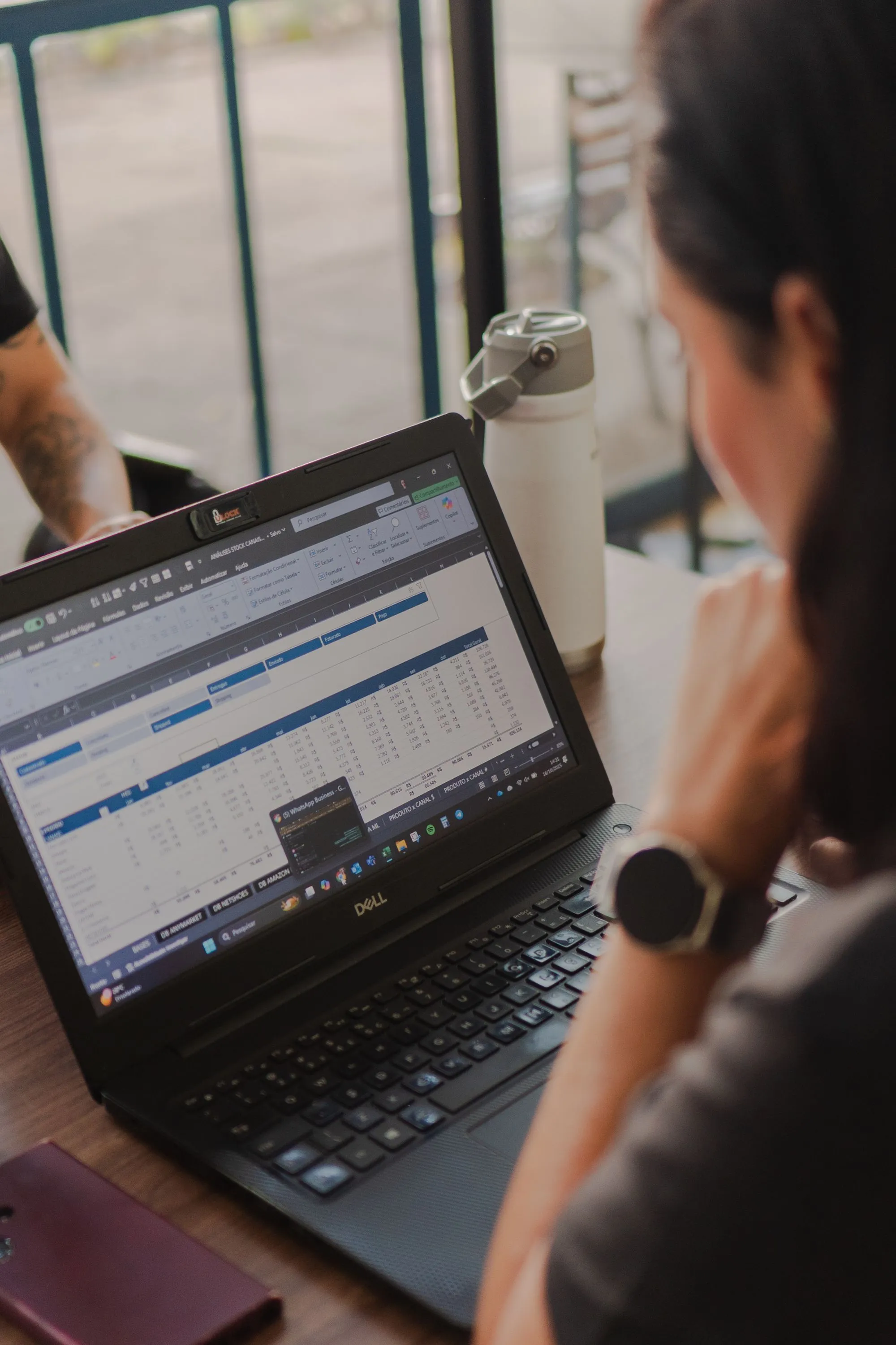 reviewing operations data on a laptop